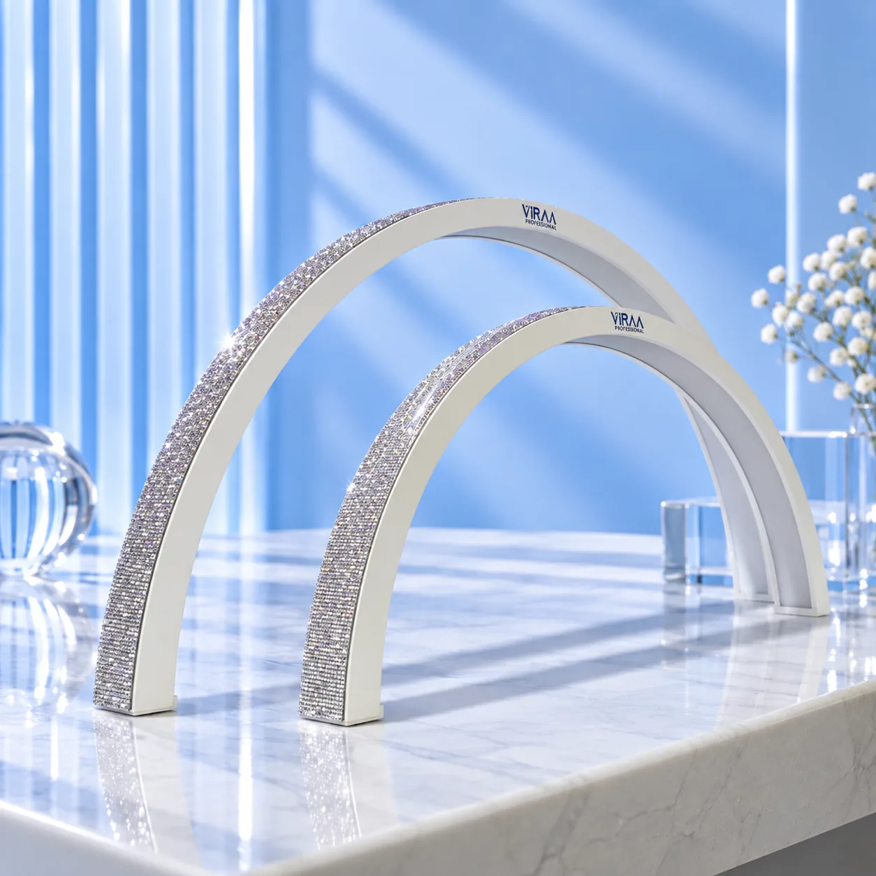 The 75cm and 57cm white moon-shaped nail table lamps angled to show the rhinestone arch