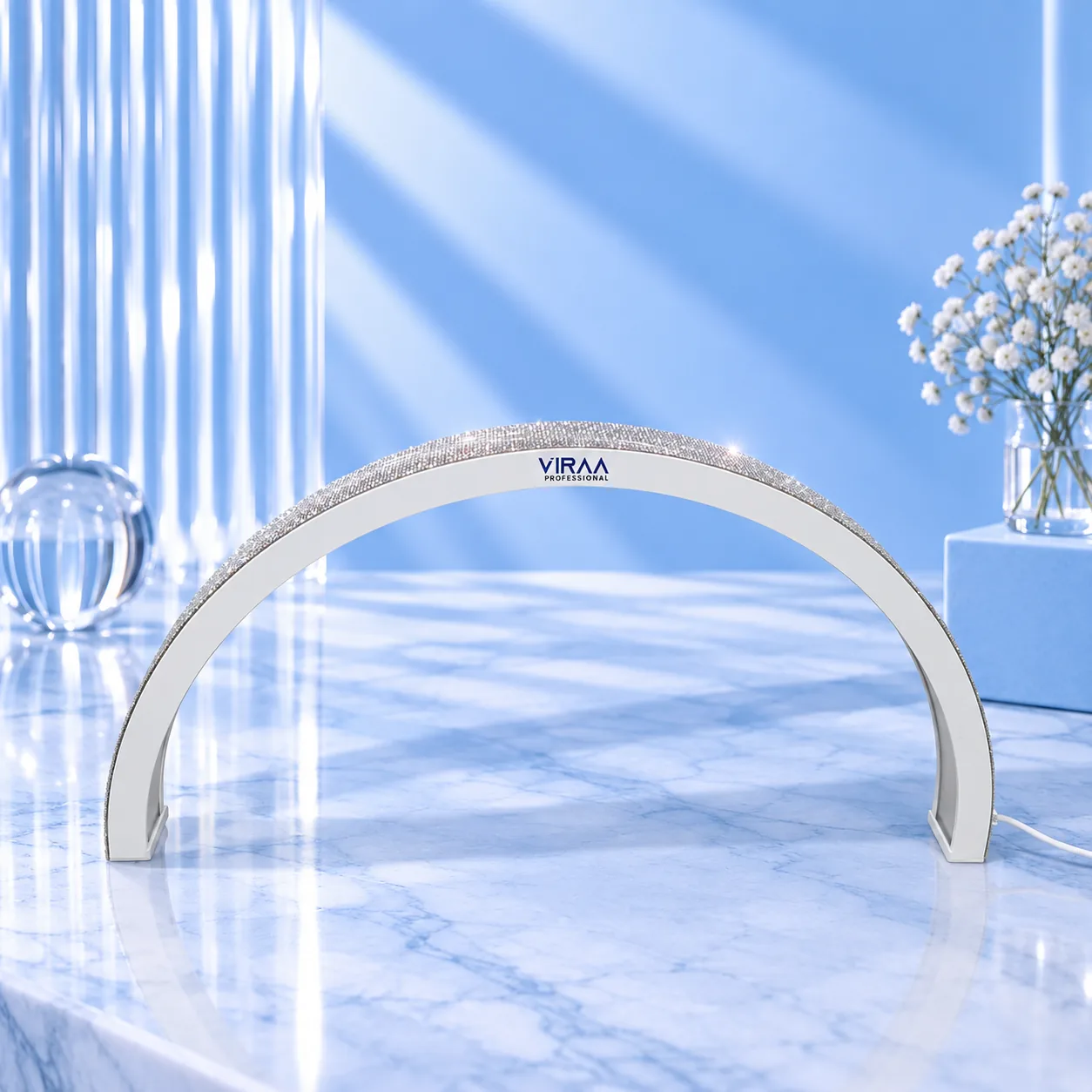 A single white moon-shaped nail table lamp with a rhinestone edge on a blue studio set