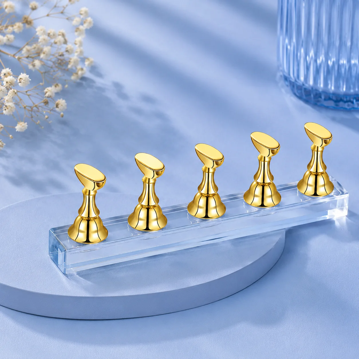 Practice Stand – Set of 5 in gold: five magnetic nail tip holders standing on a clear acrylic base