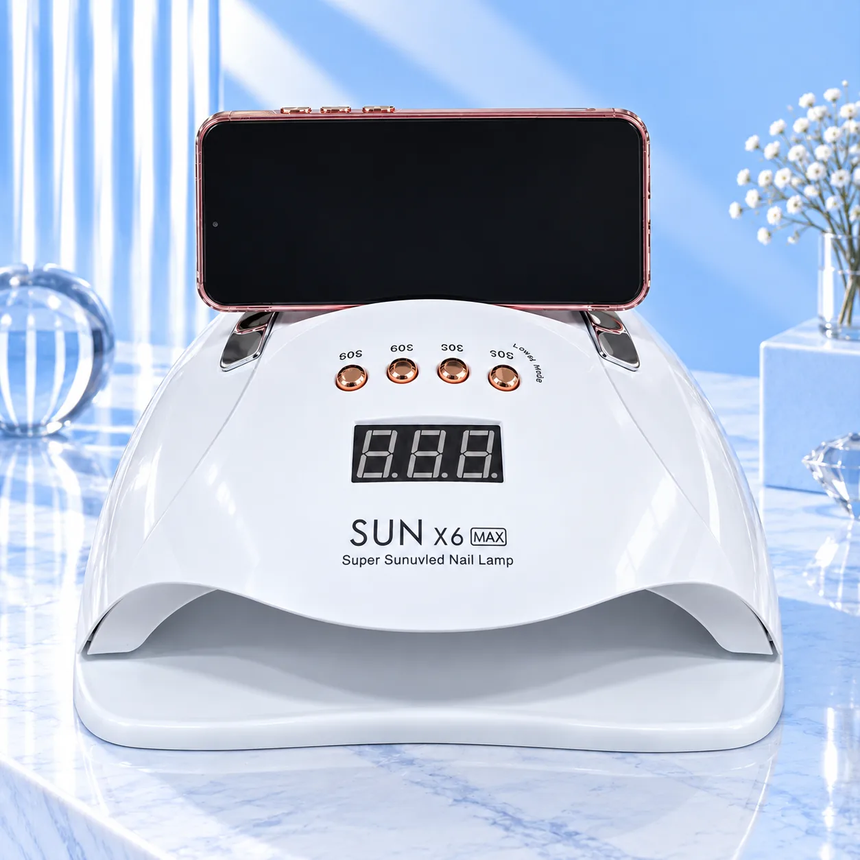 SUNX6 MAX white nail lamp, front view with the display and timer buttons and the handle folded on top