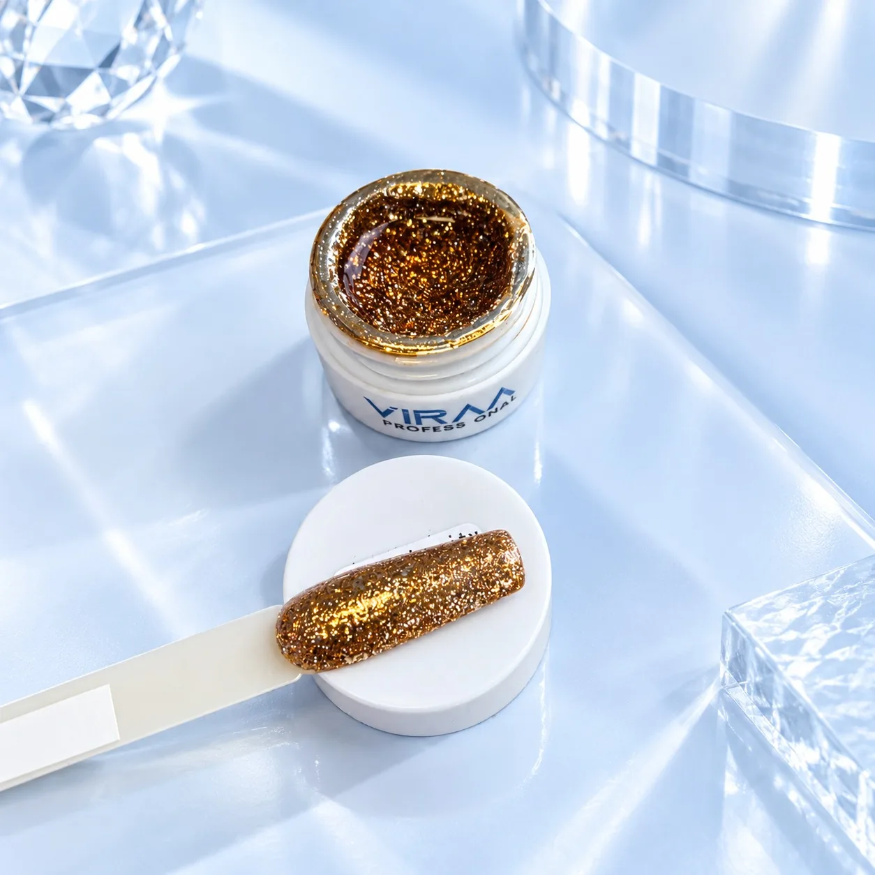 Viraa Pro High Density Platinum Gel shade 005, a burnt orange glitter, in its open 5gm pot with the shade painted on a sample tip