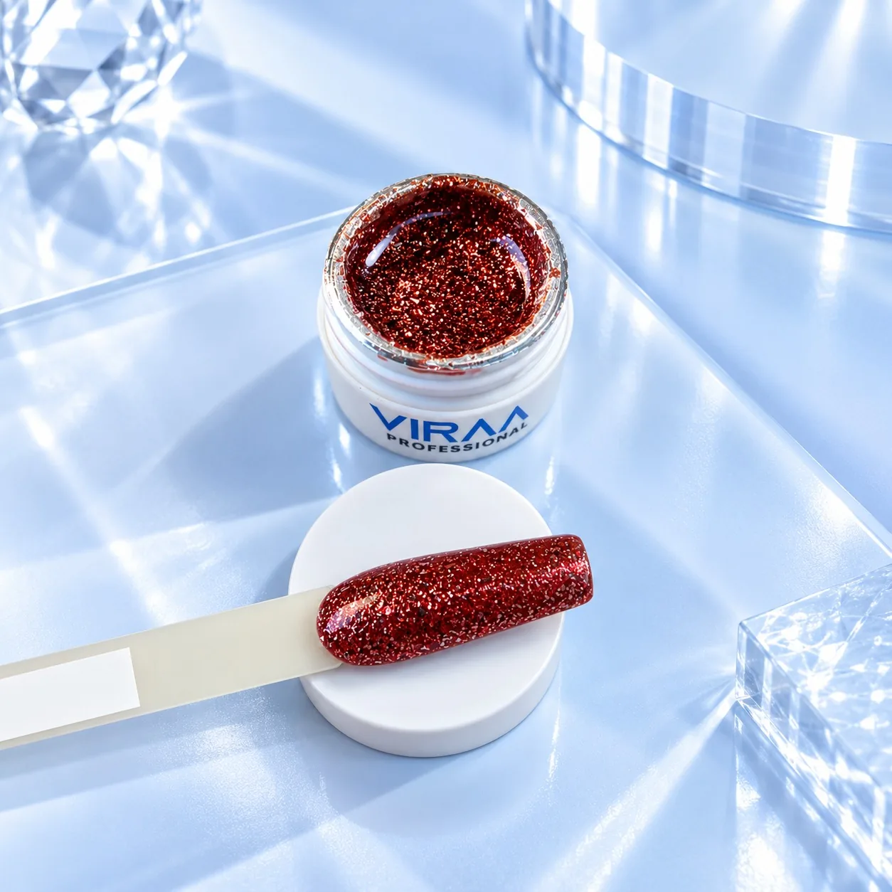 Viraa Pro High Density Platinum Gel shade 008, a deep red glitter, in its open 5gm pot with the shade painted on a sample tip