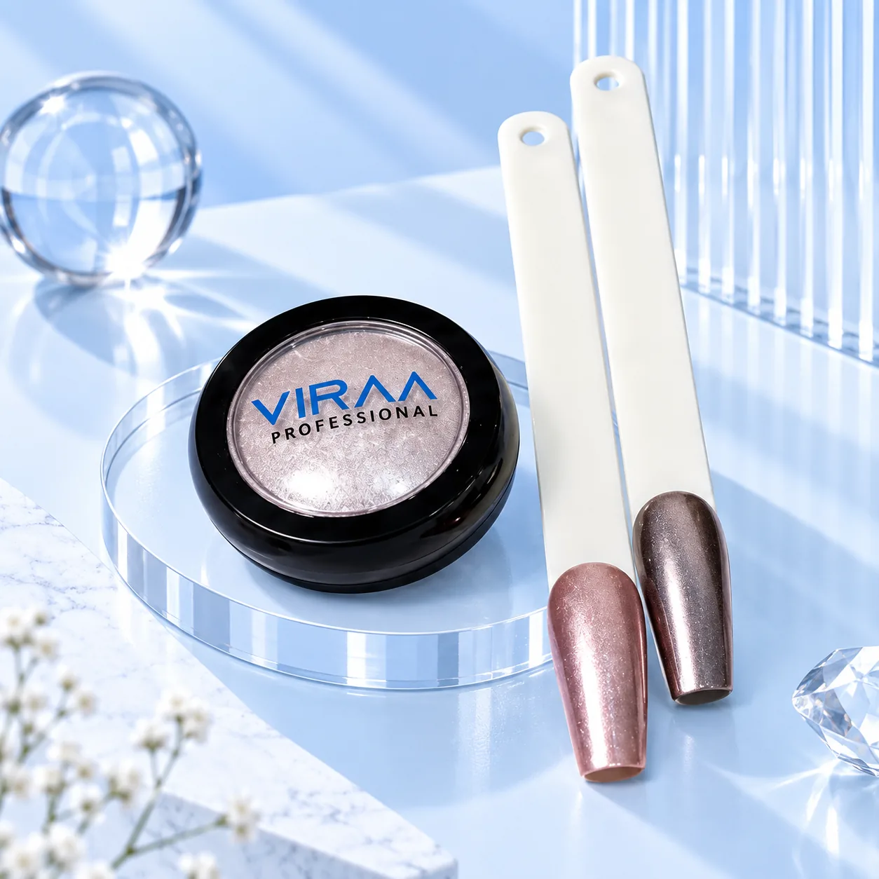 Viraa Pro Mirror Chrome Powder shade 002, a mauve pink powder, with a lighter and a darker sample nail tip