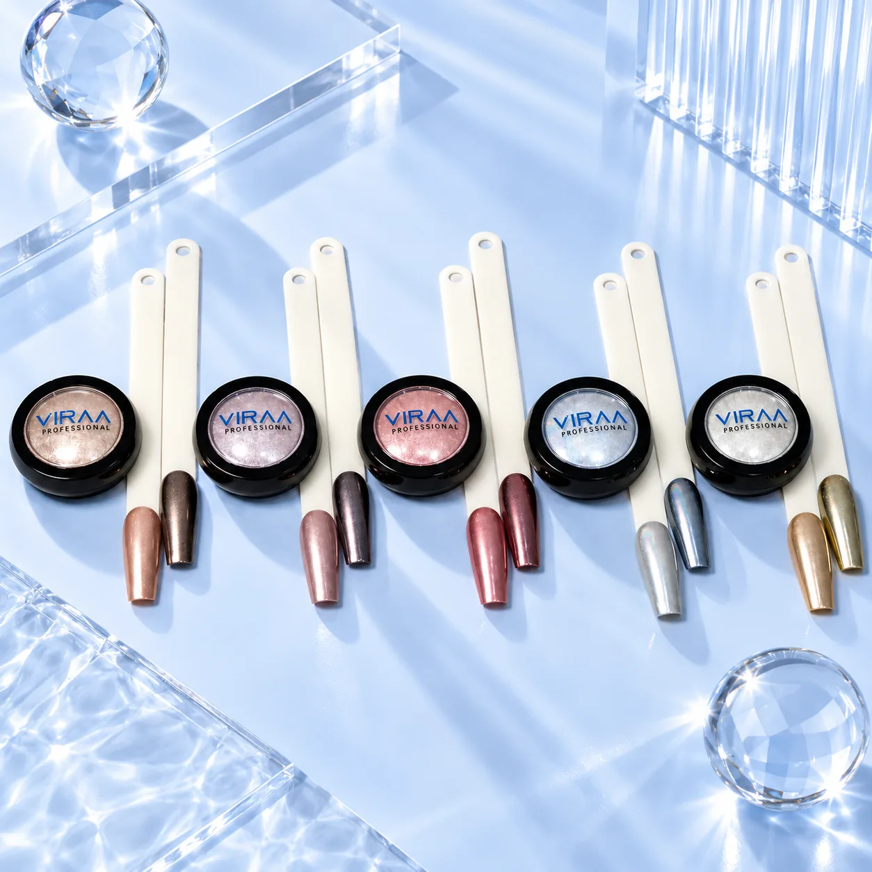 All five shades of Viraa Pro Mirror Chrome Powder in black pots, each with two sample nail tips