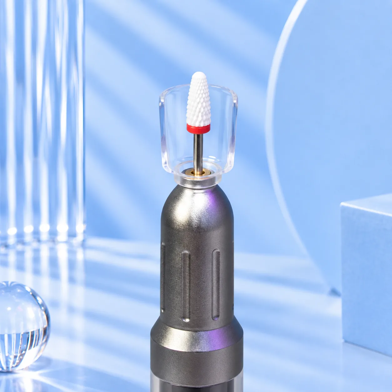 Close-up of the Viraa Pro rechargeable nail drill handpiece with a bit fitted