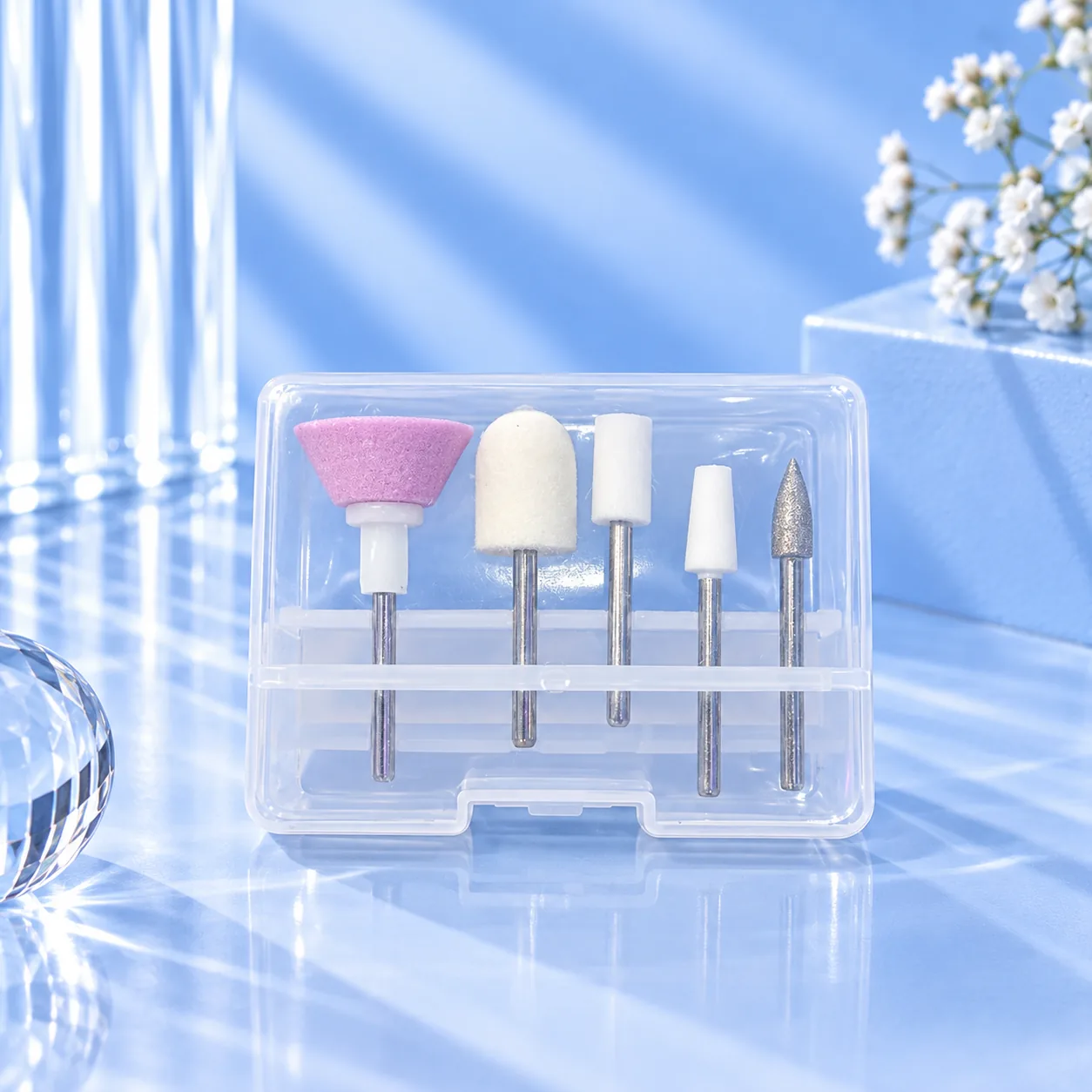 The drill bit set supplied with the Viraa Pro rechargeable nail drill, in a clear case