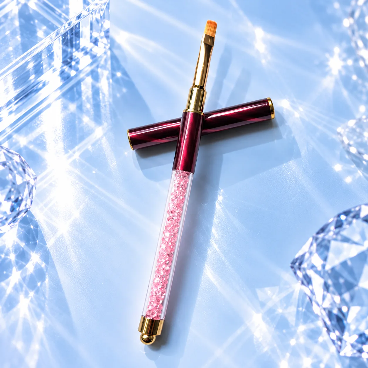 Flat brush from the VIRAA Professional 8pc nail art brush set, with a red marbled barrel and a pink crystal handle