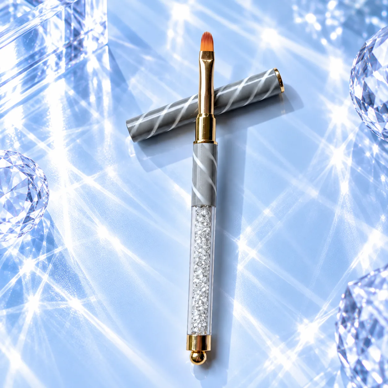 Flat brush from the VIRAA Professional 8pc nail art brush set, with a silver marbled barrel and a clear crystal handle